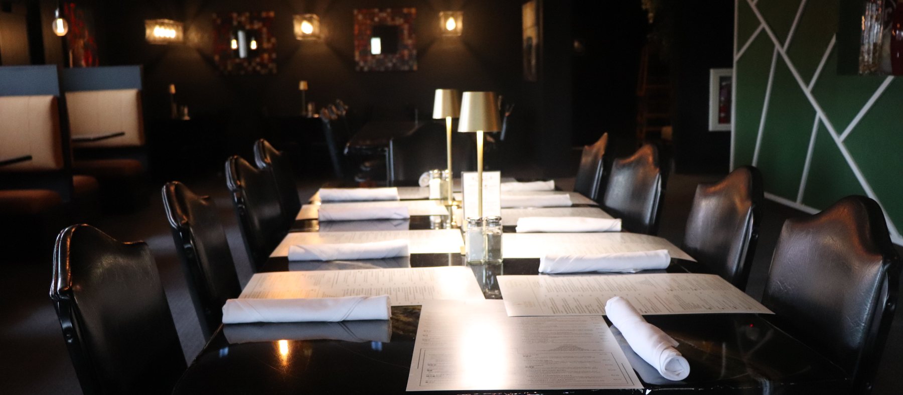 A banquet table set for a private event at Melting Borders Kitchen & Sips