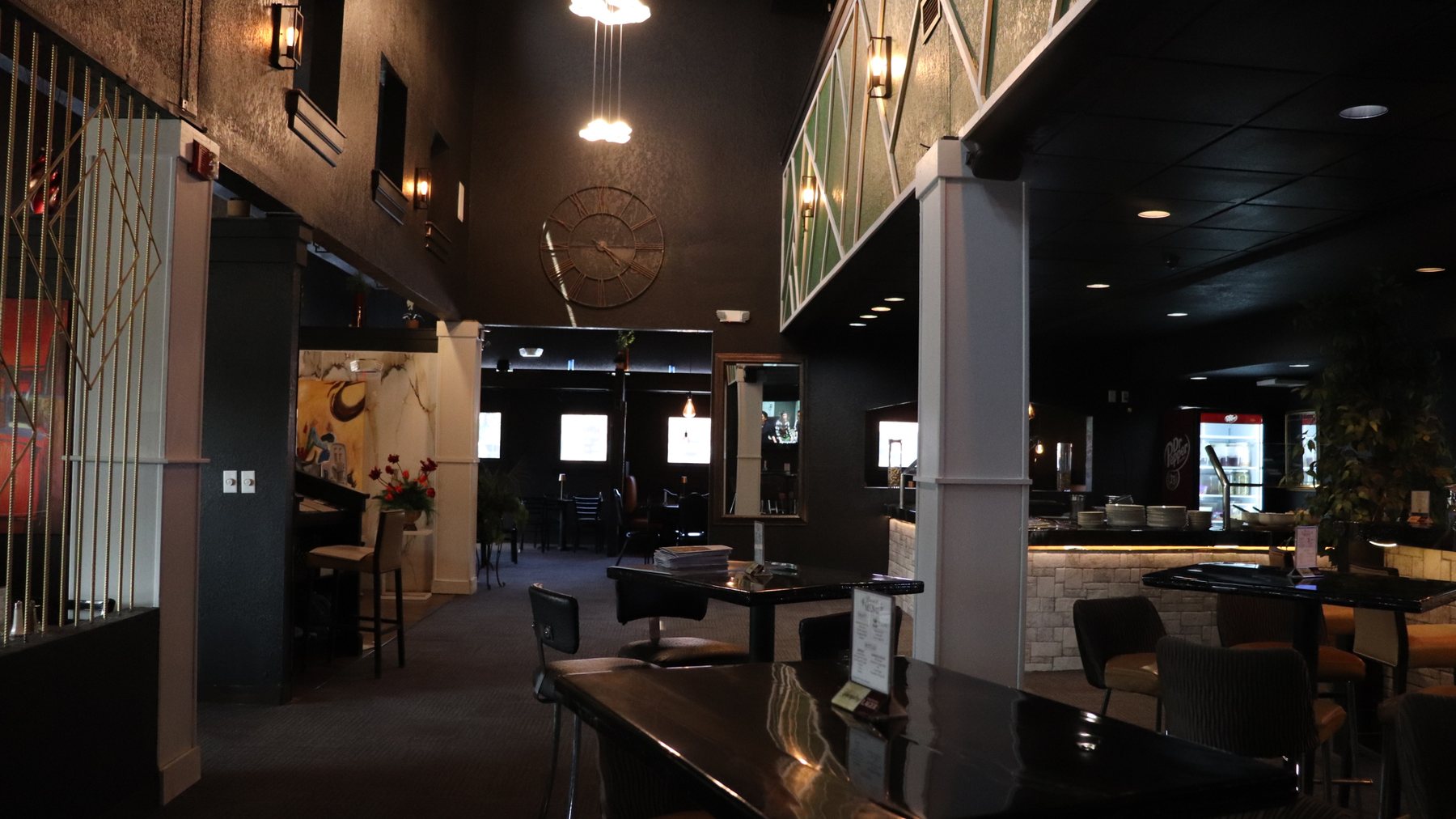 The elegant dining room at Melting Borders with warm ambient lighting