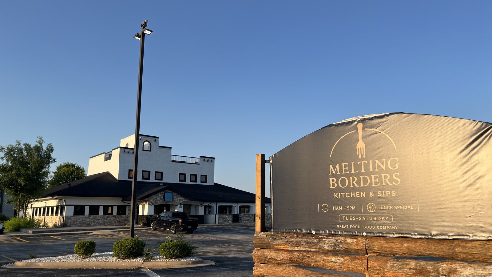 The Melting Borders Kitchen & Sips monument sign on East Montclair Street in Springfield, Missouri